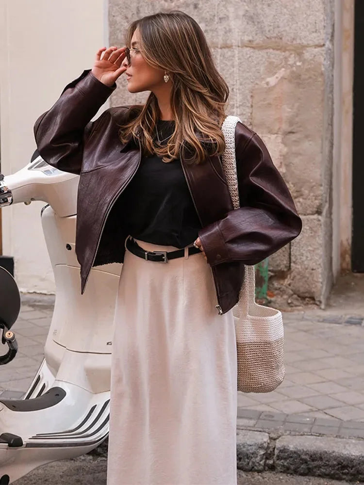 Women's retro style jacket in deep burgundy, featuring a soft fabric, buttoned front, and classic ribbed cuffs and collar.