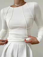 Women’s ribbed long sleeve top featuring detailed stitching, made from soft cotton blend for comfort and a stylish fit.
