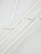 Women's ribbed long sleeve top featuring detailed stitching, made from soft cotton for comfort and a fitted silhouette.