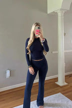 Women's ribbed lounge set featuring long sleeves and flared pants, crafted from soft, breathable fabric for comfort.