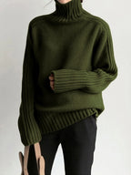 Women's ribbed mock neck knit sweater in soft fabric featuring a fitted design and cozy long sleeves, ideal for layering.