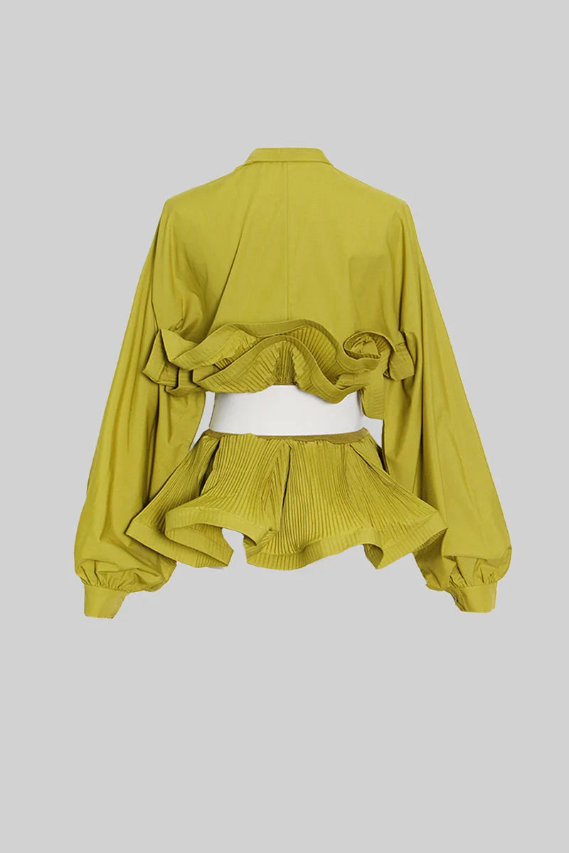 Women's ruffled belted shirt with voluminous sleeves, made from lightweight cotton with a relaxed fit and stylish details.