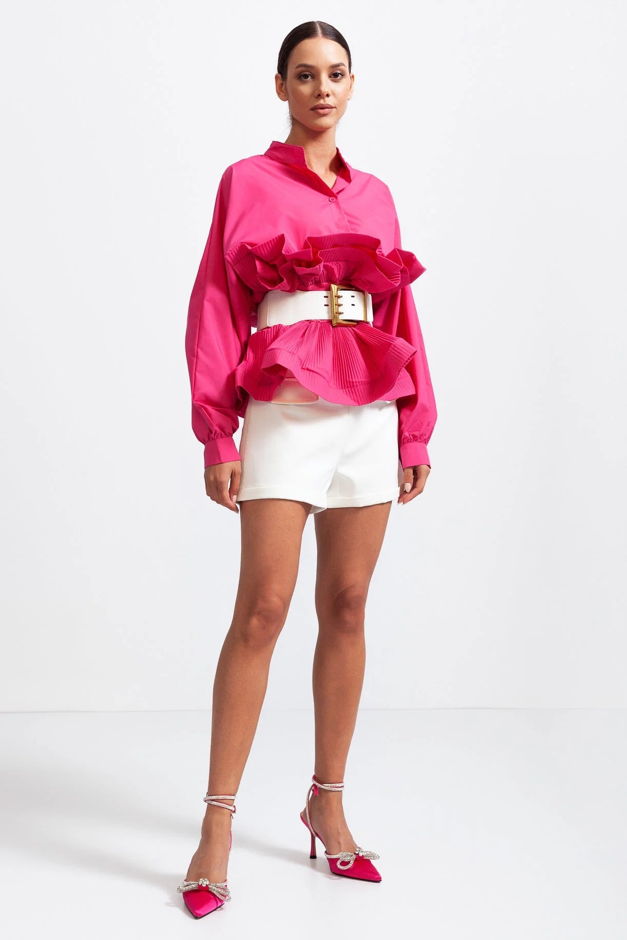Women's ruffled belted shirt featuring voluminous sleeves in a soft, breathable fabric for a relaxed yet stylish look.