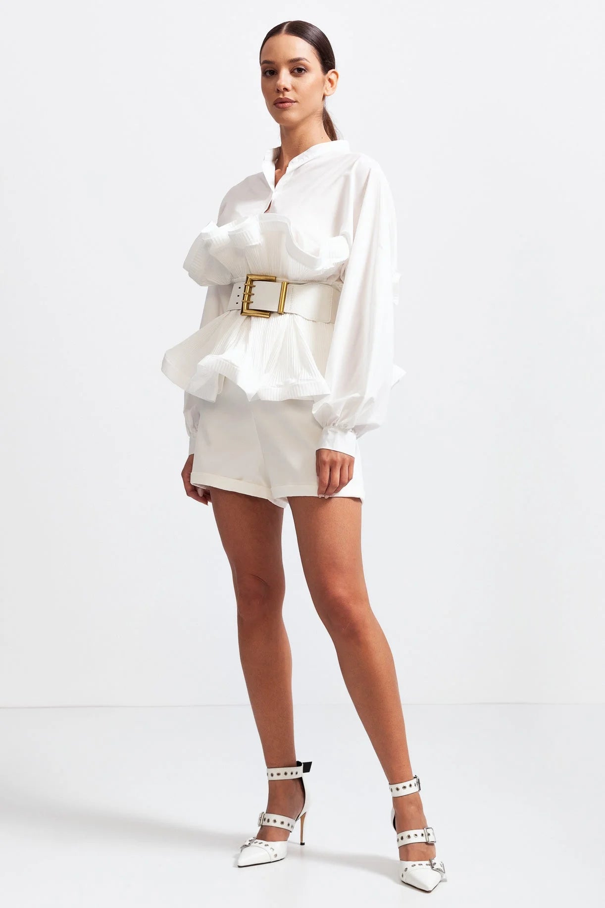 Women's ruffled belted shirt featuring voluminous sleeves, made of soft cotton blend for comfort and style.
