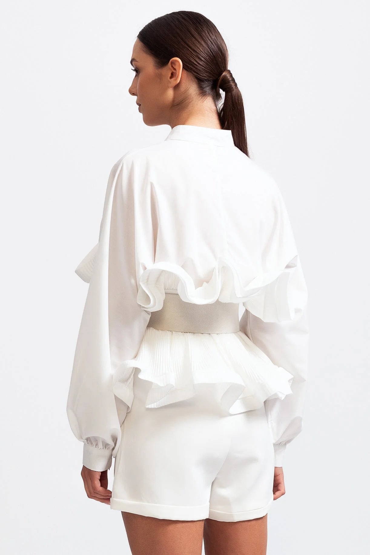 Women's ruffled belted shirt in soft cotton, featuring voluminous sleeves and a flattering waist tie for a stylish…