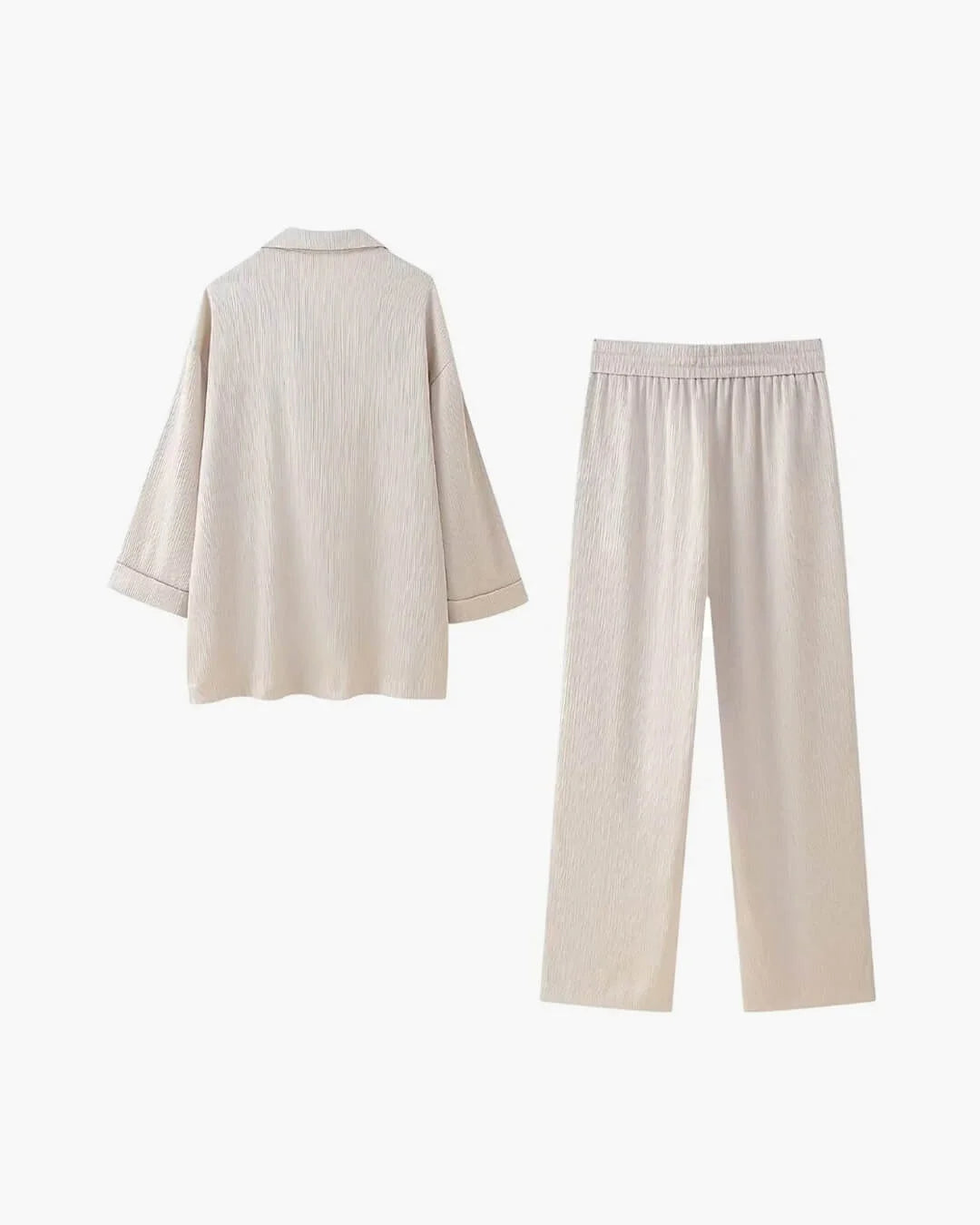 Women's satin jacket and pants set featuring a relaxed fit, smooth fabric, and a stylish, contemporary design.