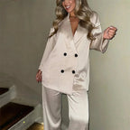 Women's satin jacket and pants set featuring a relaxed fit, soft fabric, and sleek design for comfortable wear.