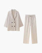Women's relaxed fit satin jacket and pants set featuring a soft sheen and comfortable drape, perfect for casual wear.