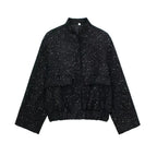 Women's sequin jacket with a modern design, featuring a shimmering finish and durable fabric for stylish layering.