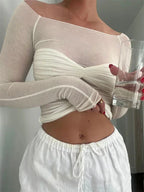 Women's sheer off-shoulder ruched top made of lightweight fabric, featuring a fitted bodice and flowing sleeves.
