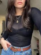 Women's sheer off-shoulder ruched top made from lightweight fabric, featuring a flattering fit and elegant drape for casual…