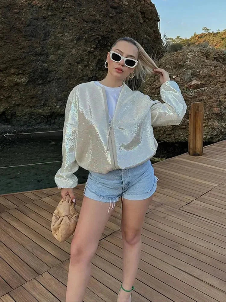 Women's ivory jacket with sequins, featuring a zip closure and a shimmering finish, crafted for a stylish look.