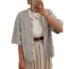 Women's short sleeve button-up cardigan made from soft cotton blend, featuring a classic design and practical front buttons.