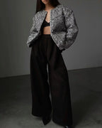 Women's silver sequin open front jacket featuring a sparkling design and lightweight material, perfect for layering on any…
