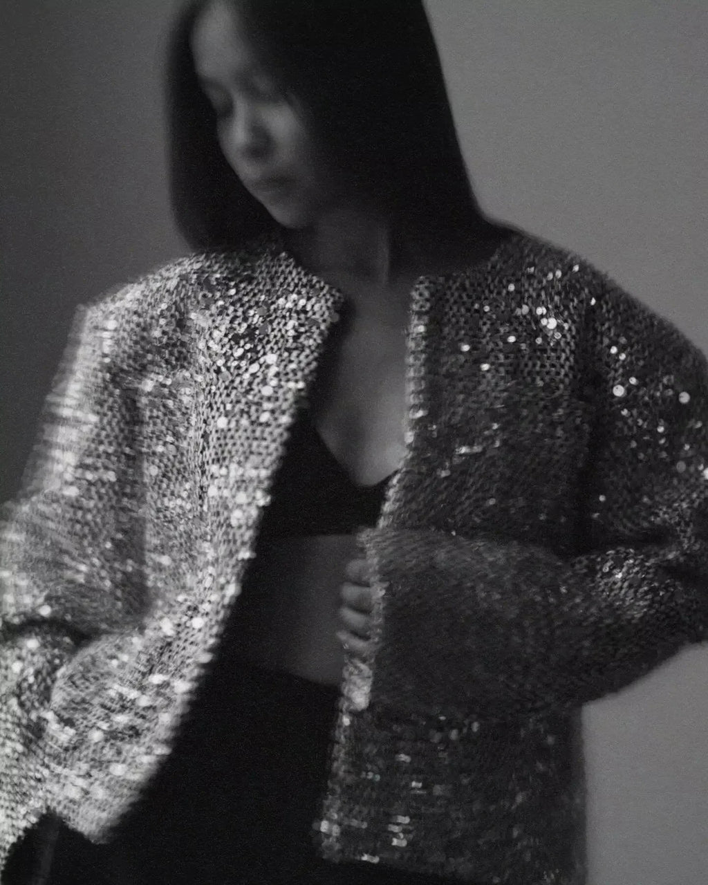 Women's open front jacket made of silver sequins, featuring a stylish, lightweight design perfect for layering.