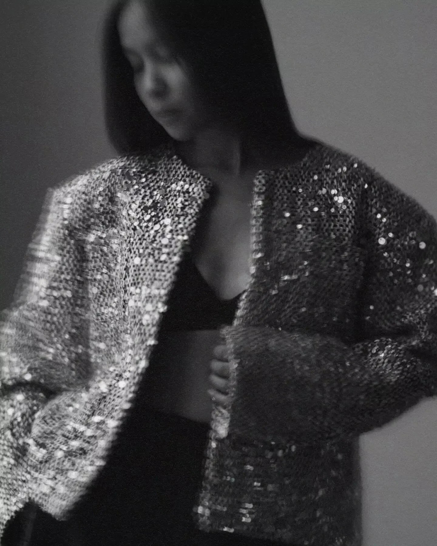 Women's open front jacket made of silver sequins, featuring a stylish, lightweight design perfect for layering.
