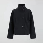 Women's stand collar loose jacket, single-breasted design in breathable fabric, featuring a relaxed fit and minimalist style.