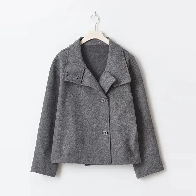 Women's stand collar, single-breasted loose jacket made of breathable fabric, featuring a relaxed fit and simple design.