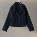 Women's stand collar single-breasted loose jacket in soft cotton, featuring two front pockets and a relaxed fit for comfort.