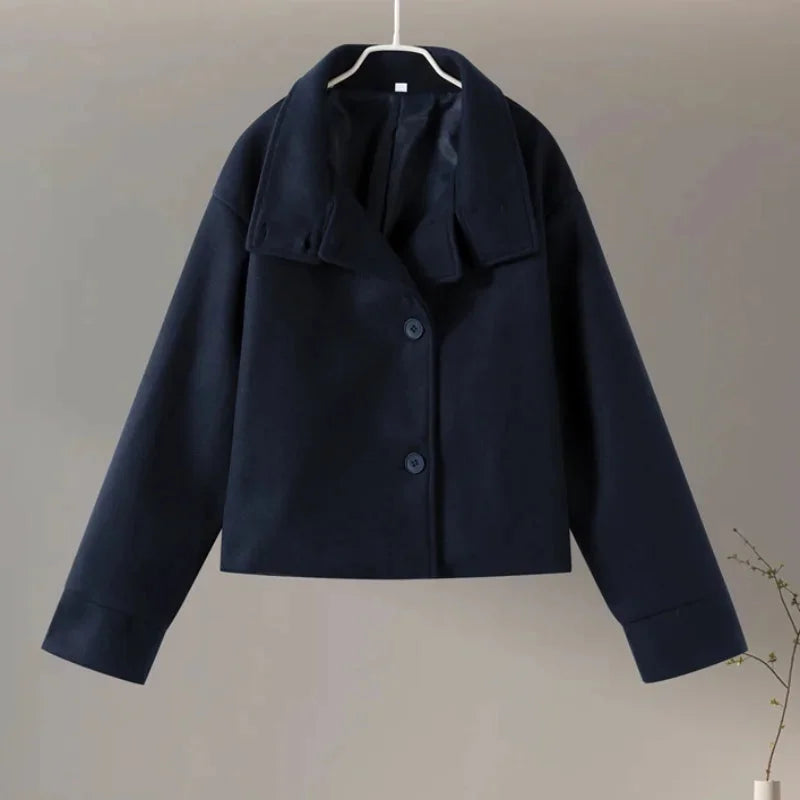 Women's stand collar single-breasted loose jacket in soft cotton, featuring two front pockets and a relaxed fit for comfort.