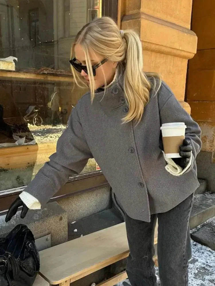 Women’s stand collar jacket in soft fabric, single-breasted design, featuring a relaxed fit and classic style for versatile…