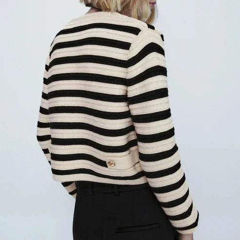 Women's striped button-up cardigan with round neckline, crafted from soft cotton blend, featuring a classic fit and ribbed…