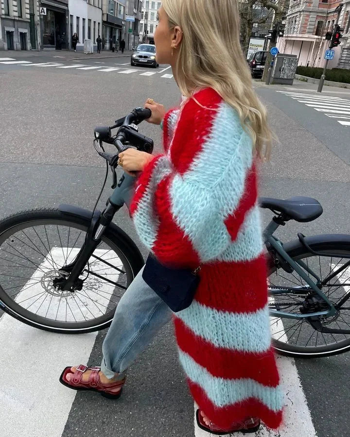 Women's striped knit long cardigan featuring soft fabric, an open front, and two front pockets for added convenience.