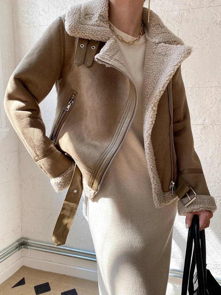 Women's suede jacket featuring faux shearling lining and zip closure for warmth and comfort in a stylish design.