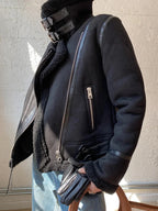 Women's suede jacket featuring faux shearling lining, zip closure, and a stylish design for added warmth and comfort.