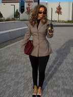Women's tailored plaid blazer featuring a classic check pattern, gold button details, and a comfortable fit for everyday…