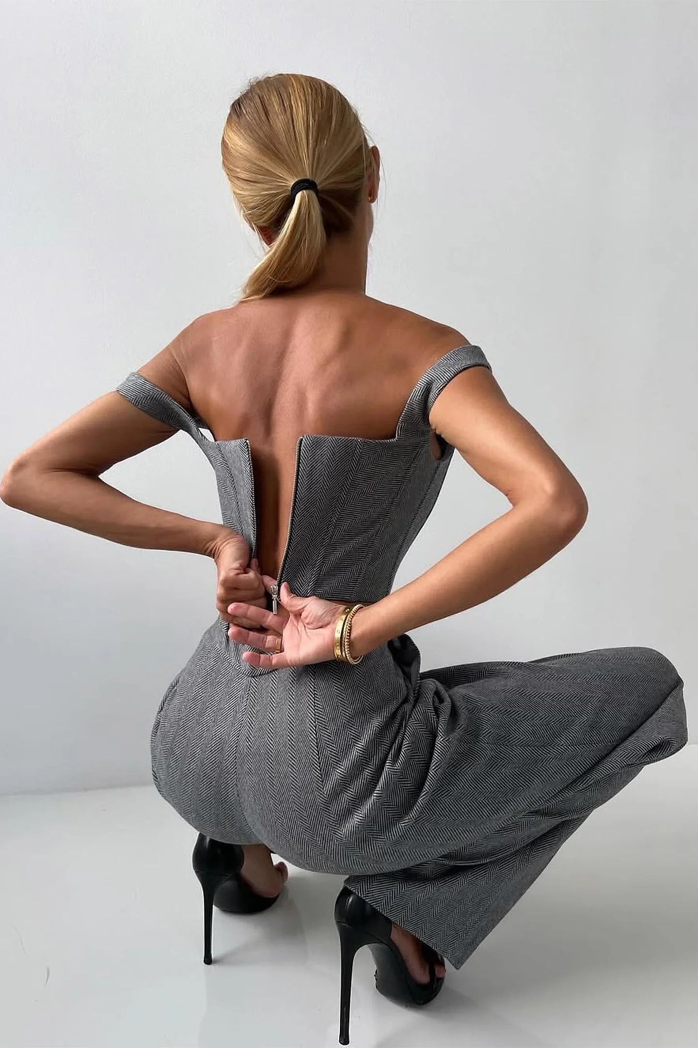 Women's tailored three-piece set featuring a fitted top, crafted from soft fabric with a classic design and elegant…