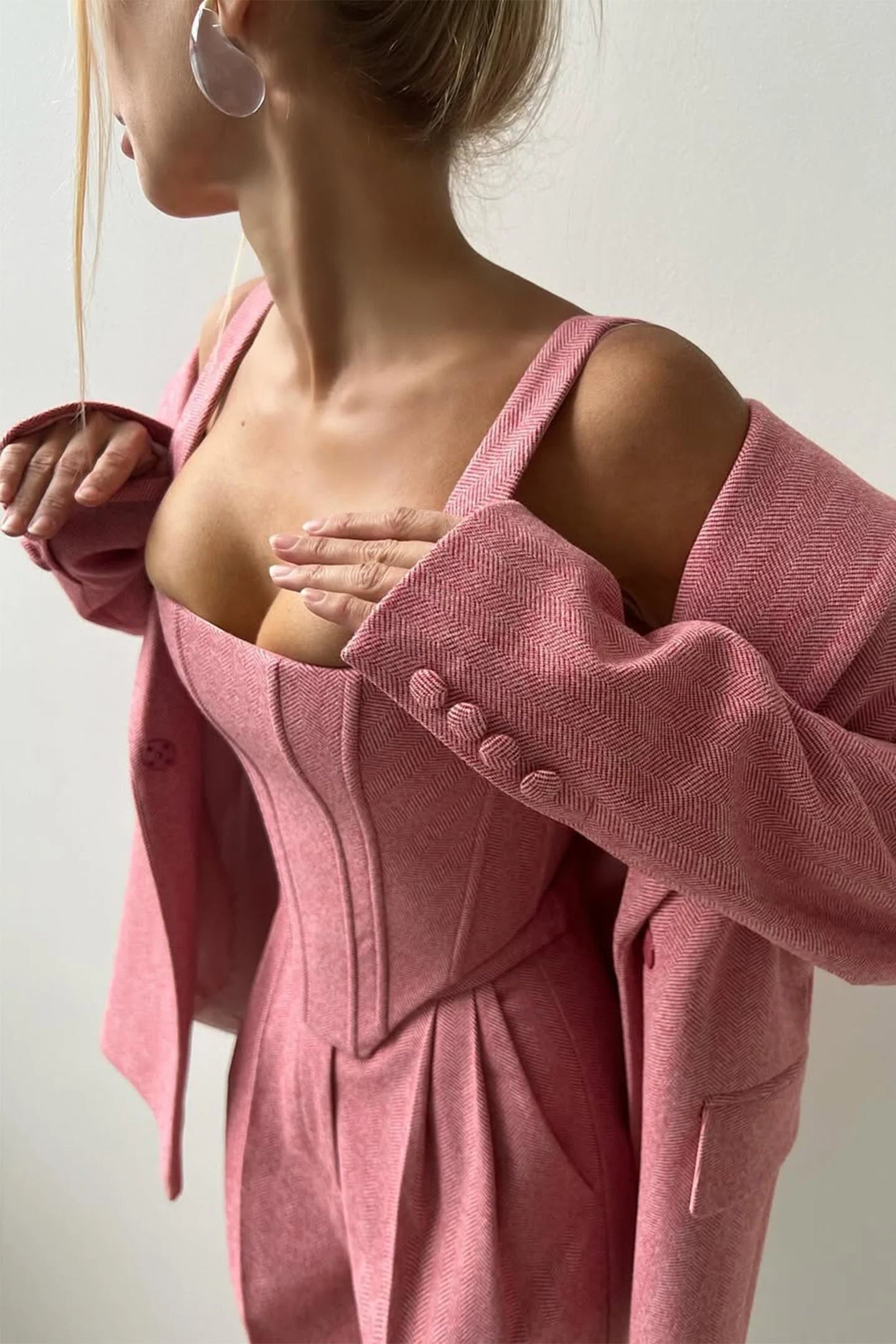 Women’s tailored three-piece set featuring a fitted top, crafted from soft fabric with a modern, structured silhouette.
