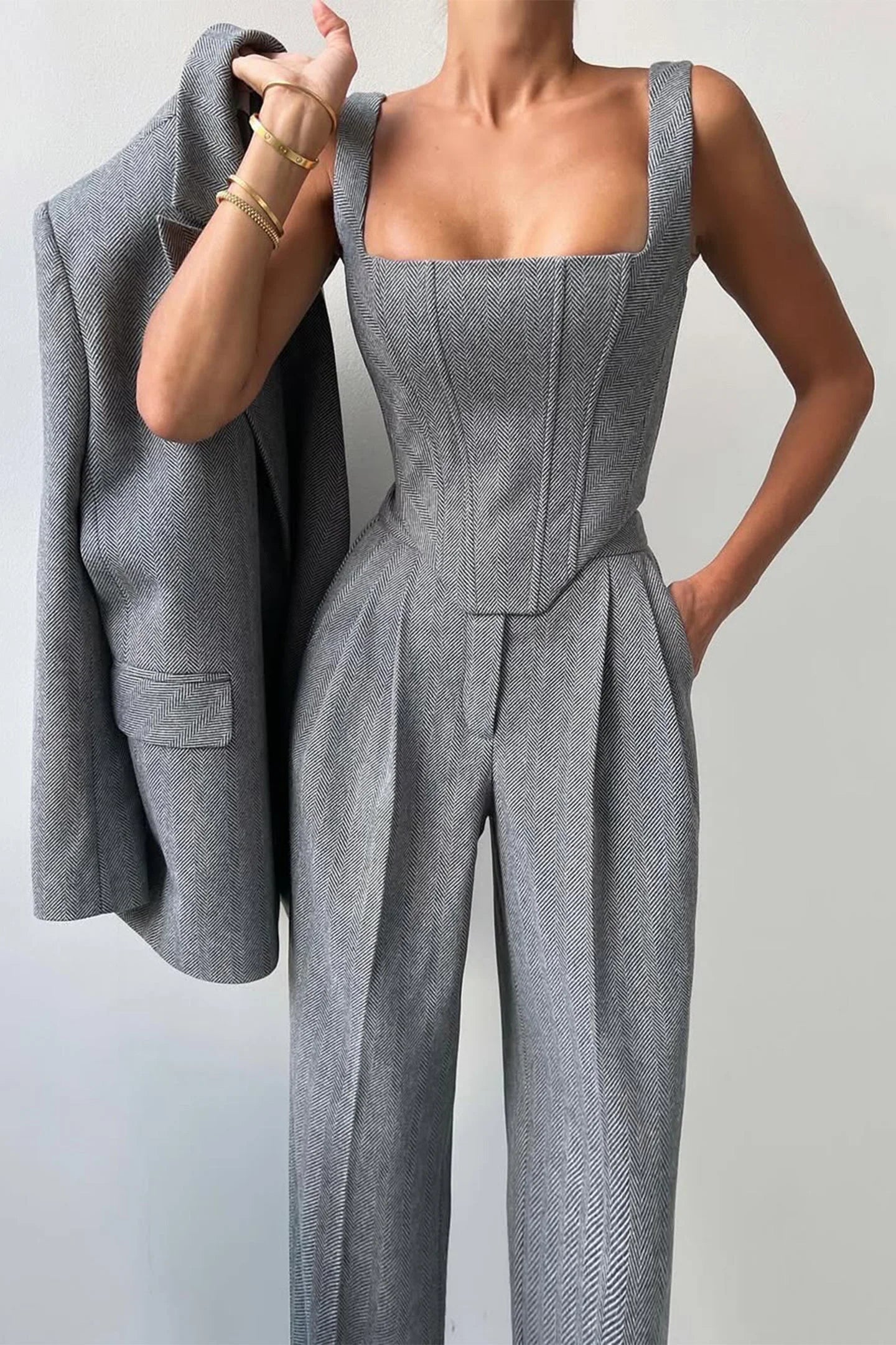 Women's tailored three-piece set featuring a fitted top, made from breathable cotton blend with structured design and subtle…
