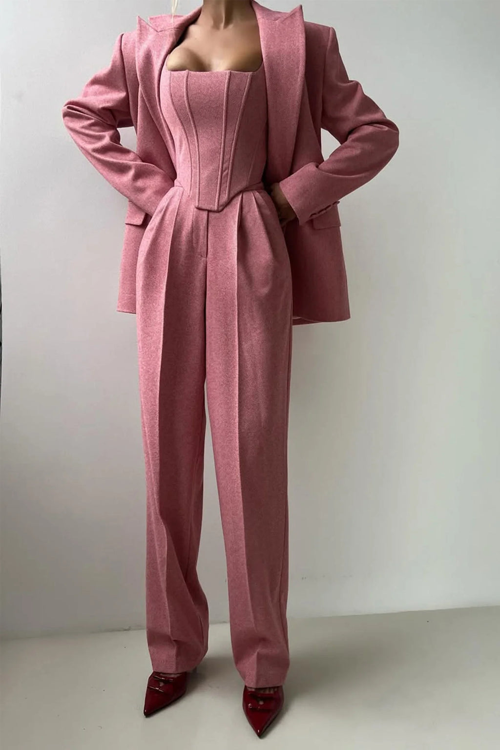 Women’s tailored three-piece set featuring a fitted top, made of soft cotton blend with structured design and subtle…