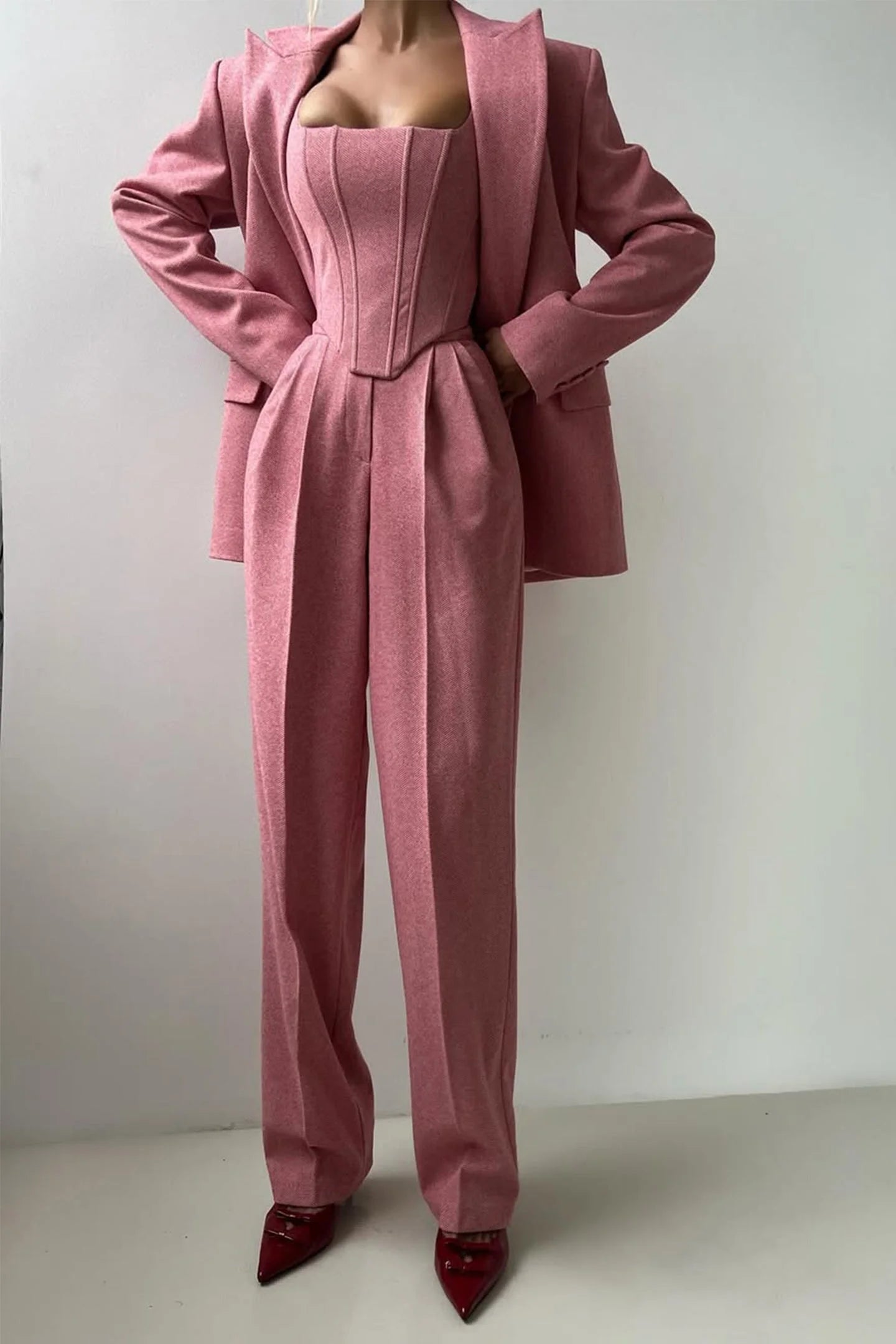 Women’s tailored three-piece set featuring a fitted top, made of soft cotton blend with structured design and subtle…