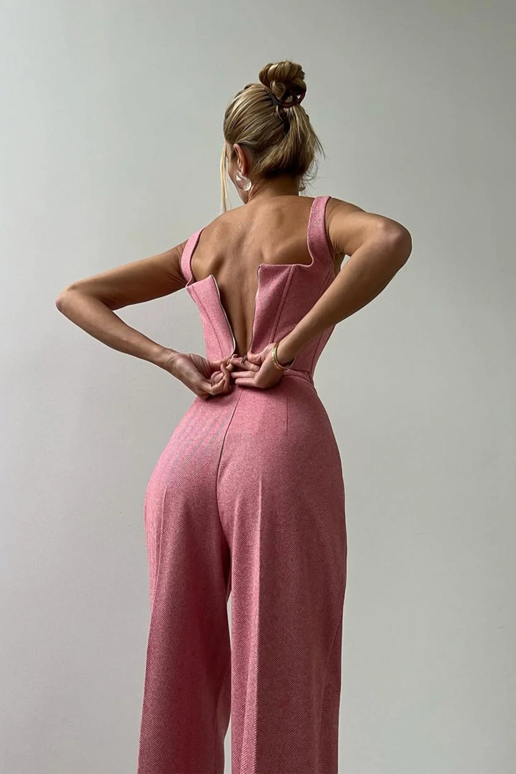 Women's tailored three-piece set featuring a fitted top, crafted from breathable fabric with a chic, structured design.