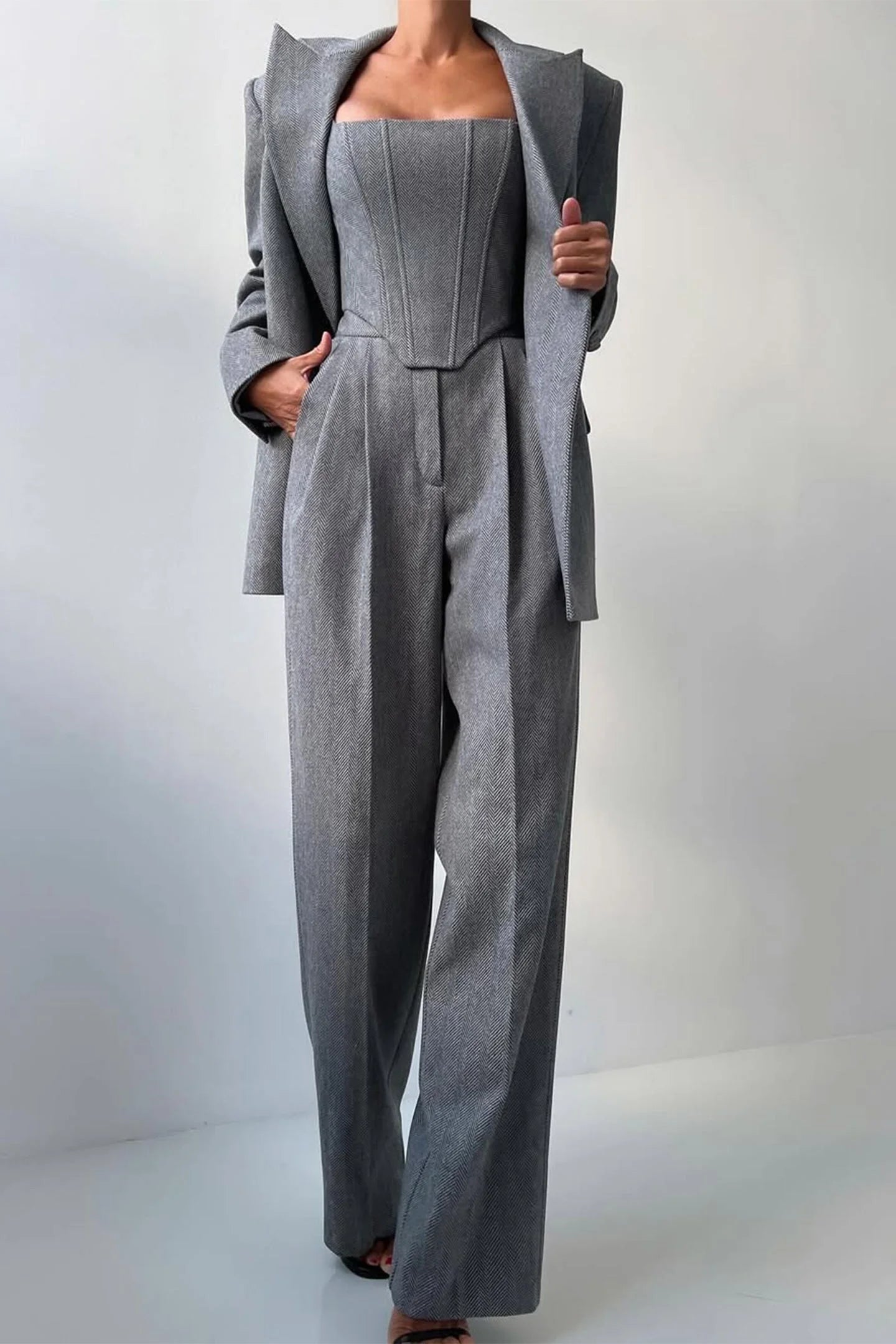 Women's tailored three-piece set featuring a fitted top, made from soft cotton blend, with elegant stitching and a classic…