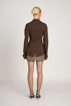 Women's tailored wrap blouse in soft cotton, featuring long sleeves and a flattering silhouette for versatile styling…