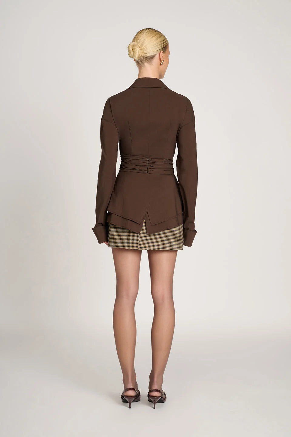 Women's tailored wrap blouse in soft cotton, featuring long sleeves and a flattering silhouette for versatile styling…