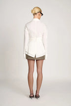 Women's tailored wrap blouse with long sleeves, made from soft fabric, featuring a flattering fit and adjustable tie for a…