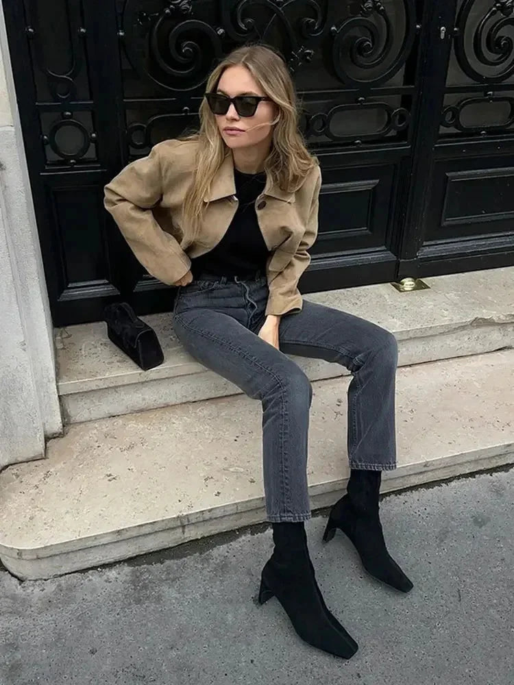 Women's tan cropped jacket made from durable cotton, featuring front pockets and a stylish, fitted design.