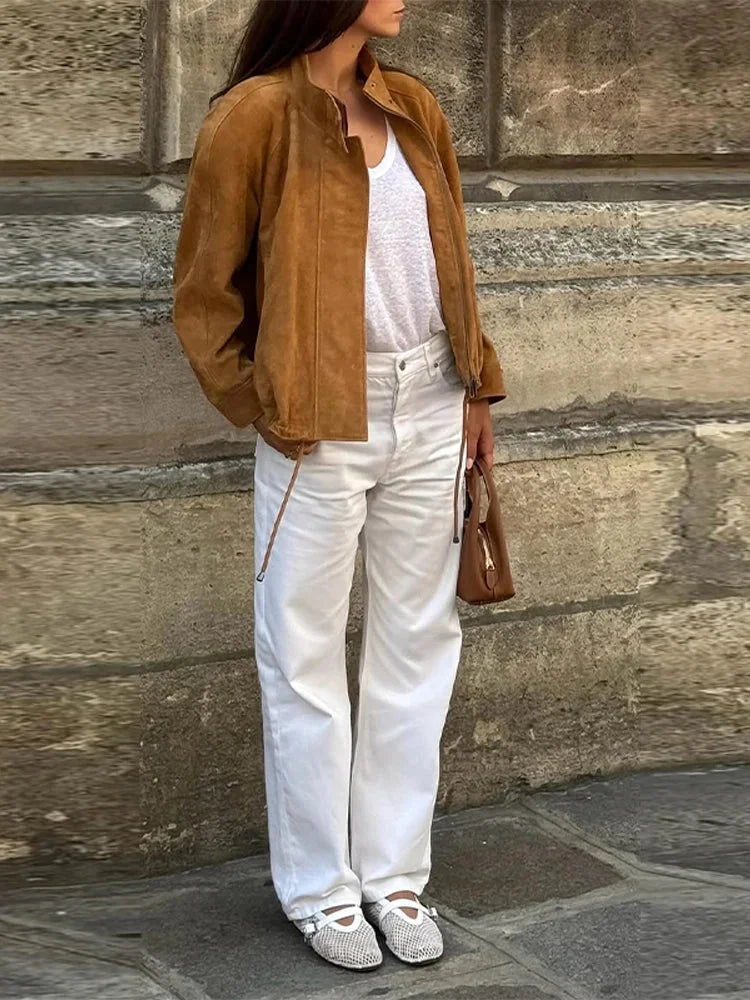 Women's tan standneck jacket featuring a zipper, long sleeves, and made from soft, durable fabric for versatile wear.
