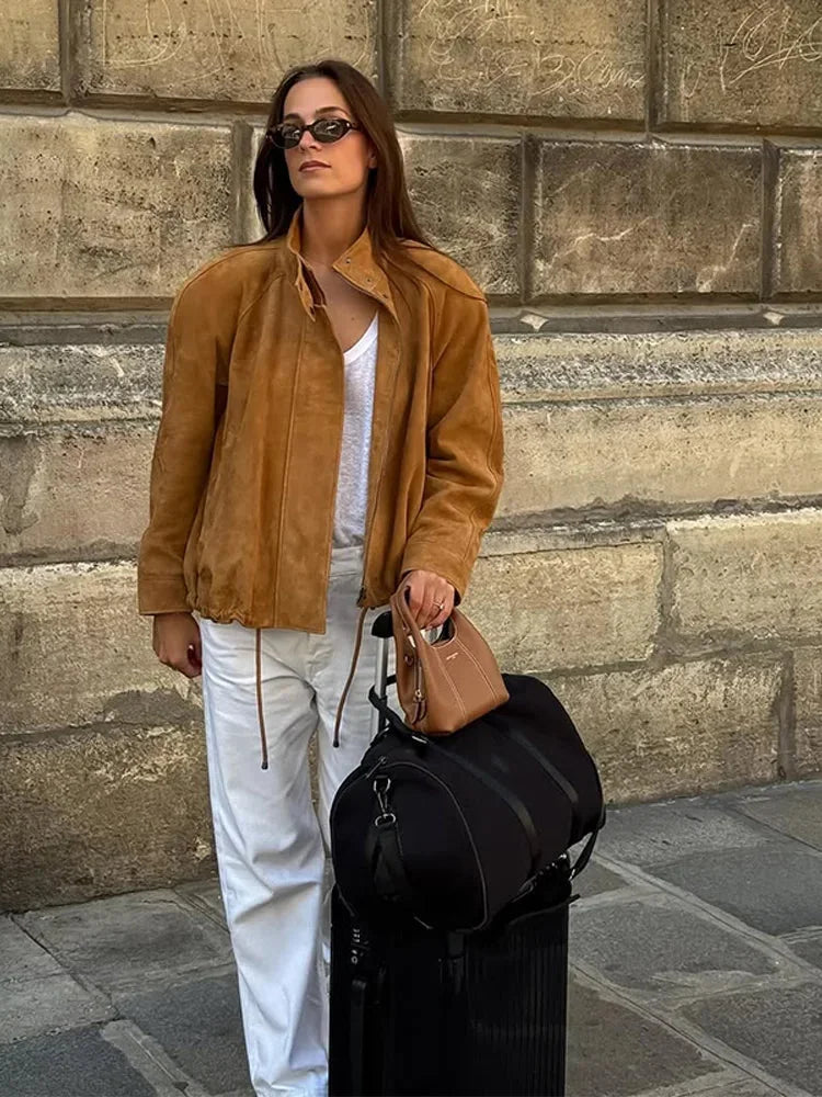 Women's tan standneck jacket featuring a zipper closure, long sleeves, and a soft, durable fabric for comfort and style.
