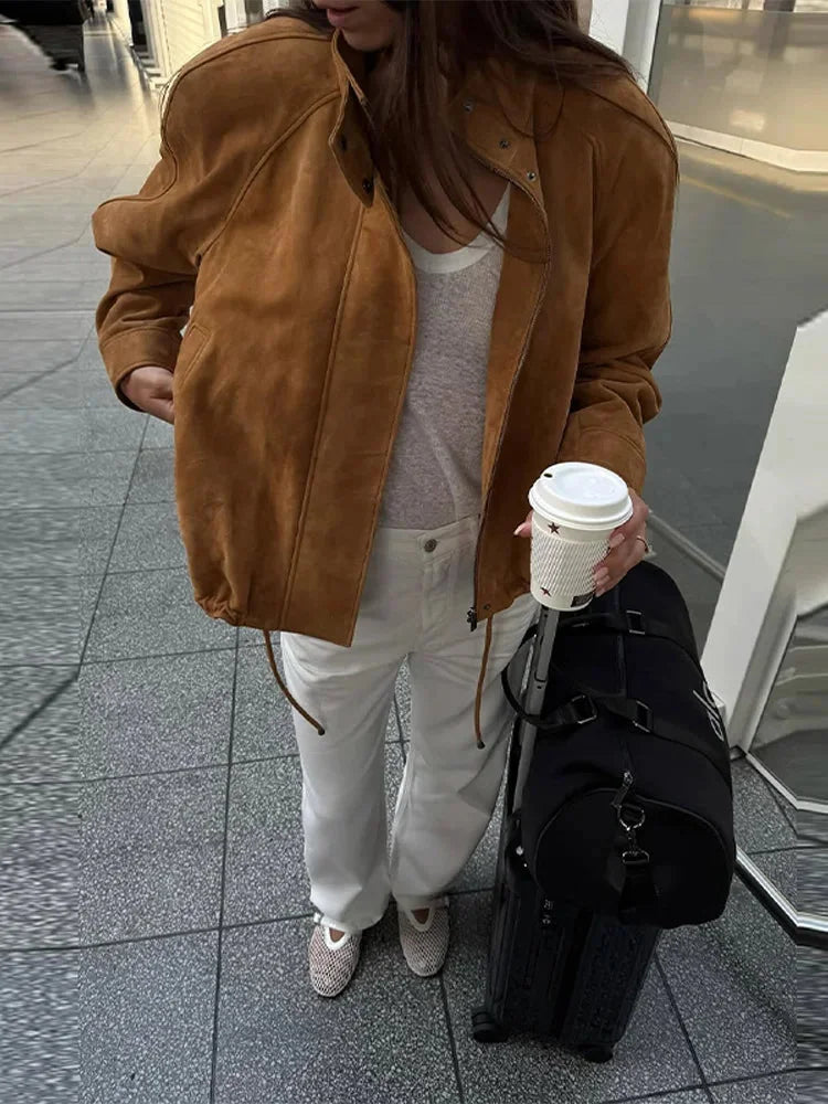Women's tan standneck jacket with zipper, long sleeves, made from soft fabric for comfort and style, ideal for cooler days.
