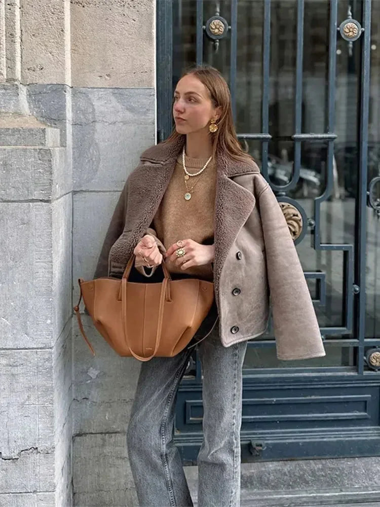 Women's taupe buttoned coat featuring a shawl collar, made from soft fabric with a relaxed fit for comfort and style.