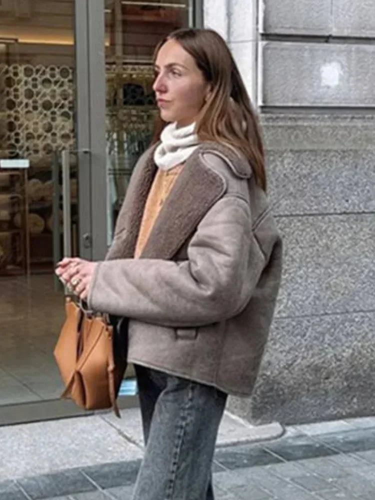 Women's taupe buttoned coat with shawl collar, made from soft fabric, features a relaxed fit and two front pockets.