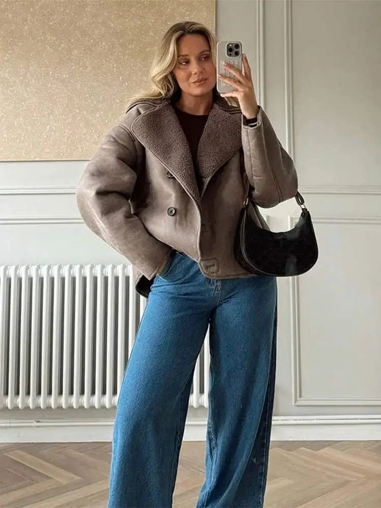 Women's taupe coat with shawl collar, featuring button closure and soft fabric for a cozy fit. Ideal for casual wear.