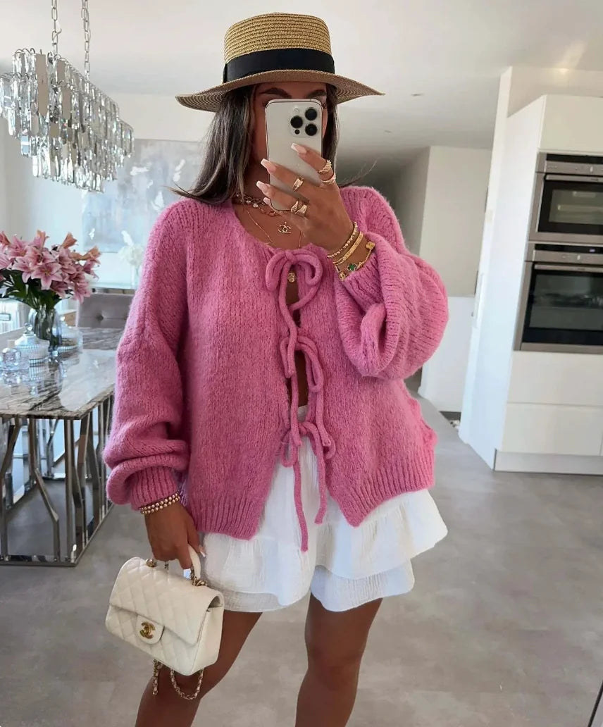 Women's knitted cardigan with tie-front closure, oversized sleeves, crafted from soft, comfortable yarn for everyday wear.