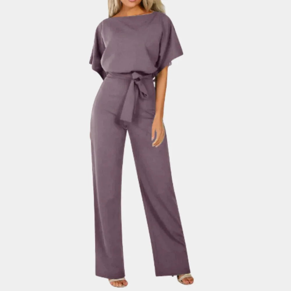 Women's wide-leg jumpsuit with tie-waist and kimono sleeves in soft cotton blend for a relaxed, stylish fit.