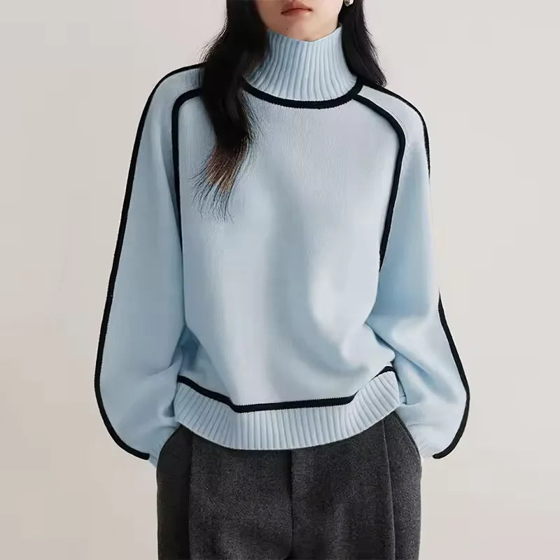 Women's turtleneck knit sweater featuring contrast trim, made of soft acrylic for warmth and comfort during cooler days.